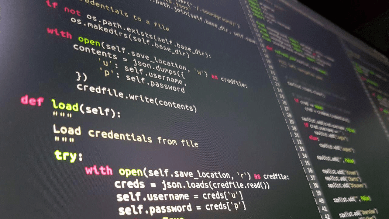 Photo of a computer screen with vim running, editing Python code